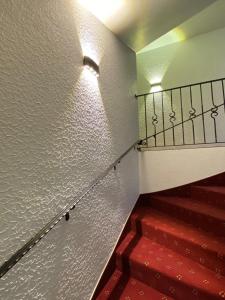 a staircase leading up to a stairway with a fire hydrant at Hotel Pension Berghaus Sieben in Bad Laasphe