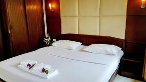 Areena Resort and Hotel Uttaradit客房内的一张或多张床位