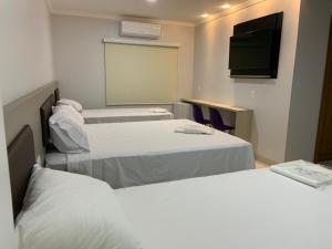 Postel nebo postele na pokoji v ubytování Hotel Uipi