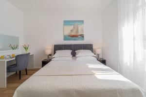 Posteľ alebo postele v izbe v ubytovaní Apartman Letifico