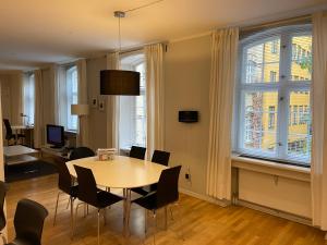 a dining room with a table and chairs at Gothersgade in Copenhagen
