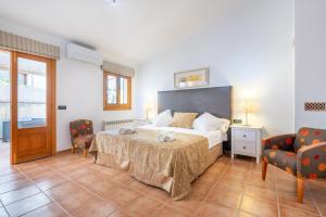 Postel nebo postele na pokoji v ubytování Casa Horta Den Menut + 17 fotografií