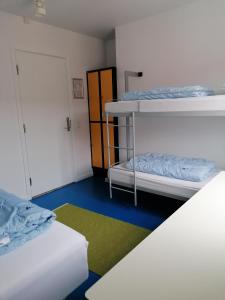 Postel nebo postele na pokoji v ubytování Femmasteren Hotel & Hostel