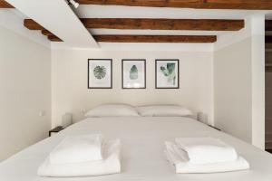 Кровать или кровати в номере Porta Venezia Modern Loft - The Green Door
