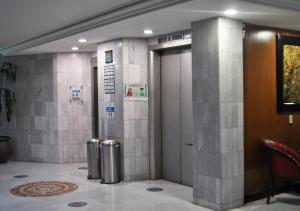 a lobby with a elevator and a door in a building at Hotel Arroyo de la Plata in Zacatecas