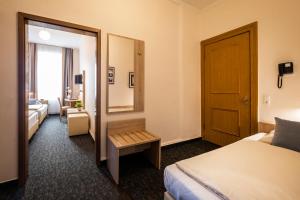 Postel nebo postele na pokoji v ubytování Hotel Jensen