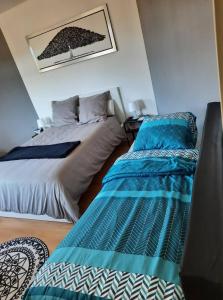 Postel nebo postele na pokoji v ubytování Studio Soleil au Hohwald