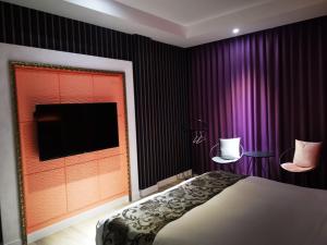 Postel nebo postele na pokoji v ubytování Love Story Motel
