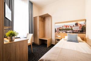 Postel nebo postele na pokoji v ubytování Hotel Jensen