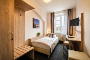 TV a/nebo společenská místnost v ubytování Hotel Jensen