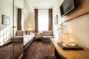 TV a/nebo společenská místnost v ubytování Hotel Jensen