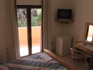 TV a/nebo společenská místnost v ubytování Guest House Caterina
