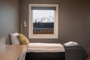 Postel nebo postele na pokoji v ubytování Fast Hotel Svolvær