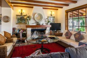a living room filled with furniture and a fireplace at LA VINYA GRAN in Port de Pollensa