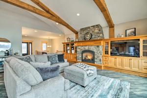 a living room with a couch and a fireplace at Luxe Lake Latoka Home with Dock, Hot Tub and Game Room in Alexandria