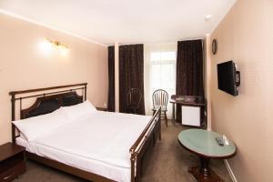 Кровать или кровати в номере Отель Наутилус