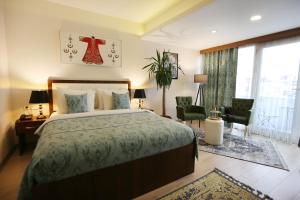 מיטה או מיטות בחדר ב-Cebeci Grand Hotel