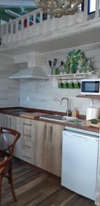 A kitchen or kitchenette at Apartamentos A Poniente