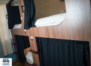 a pair of bunk beds in a tiny house at Blue House Youth Hostel in Quito