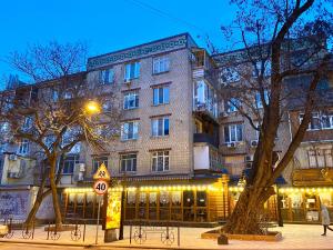 a large building with lights in front of it at Deribasovskaya Center Apartment in Odesa