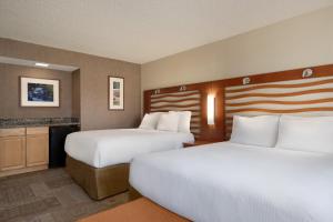 
a hotel room with two beds and two lamps at Poco Diablo Resort in Sedona

