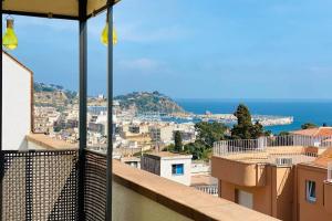 a view of a city from the balcony of a building at Ático con Vistas al Mar a un Paso del Centro in Blanes