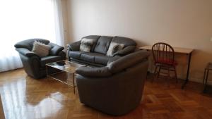 a living room with a couch and a chair at Administracion Callao in Buenos Aires