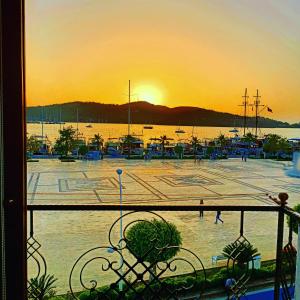 a view of a marina at sunset from a balcony at Mermaid suite in Fethiye