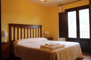 Postel nebo postele na pokoji v ubytování Apartamentos NOGUERA de ALBARRACÍN