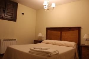 Postel nebo postele na pokoji v ubytování Apartamentos NOGUERA de ALBARRACÍN