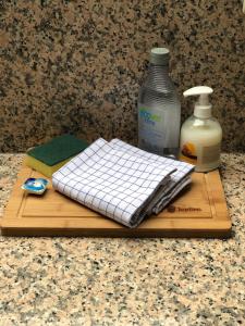 a cutting board with a napkin and a bottle of milk at Enjoy Durbuy 2 in Durbuy