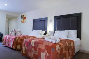 Postel nebo postele na pokoji v ubytování Hotel Posada Guadalupe