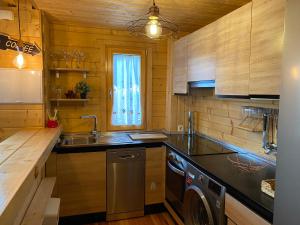 a kitchen with a sink and a dishwasher at Apartamento Rural La Casita de Mateo in Rascafría