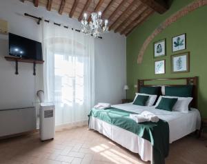 A bed or beds in a room at Agriturismo Le Biricoccole