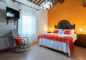 A bed or beds in a room at Agriturismo Le Biricoccole