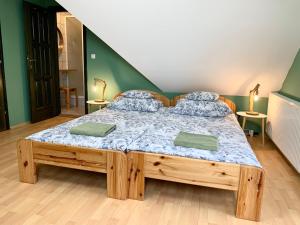 Postel nebo postele na pokoji v ubytování Vazul Vendégház