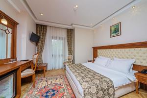Un pat sau paturi într-o cameră la Hotel Spectra Sultanahmet