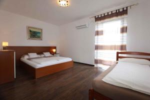 Posteľ alebo postele v izbe v ubytovaní Apartment in Silo/Insel Krk 13419