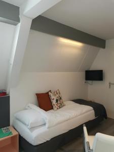 Postel nebo postele na pokoji v ubytování B&B Bovenweg