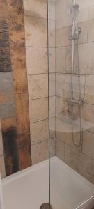 a shower with a glass door in a bathroom at The lodge in Blackwood