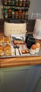 a counter top with a bunch of bread and eggs at The lodge in Blackwood