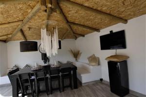 a dining room with a black table and chairs at Finca Rayo del Sol in Alhaurín el Grande