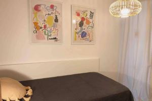 A bed or beds in a room at Edifici Ciutadella