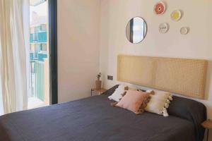 A bed or beds in a room at Edifici Ciutadella