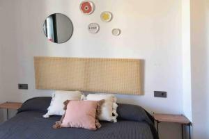 A bed or beds in a room at Edifici Ciutadella