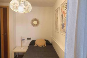 A bed or beds in a room at Edifici Ciutadella