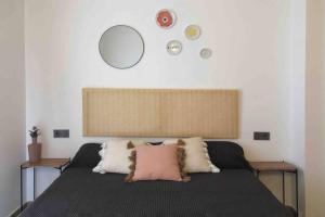 A bed or beds in a room at Edifici Ciutadella