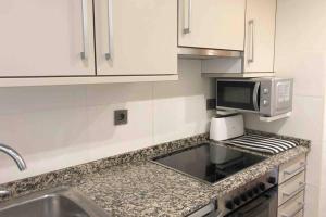A kitchen or kitchenette at Edifici Ciutadella