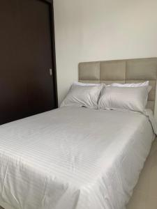 Säng eller sängar i ett rum på Bellavista VIP apartamento FULL equipado