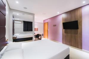 TV a/nebo společenská místnost v ubytování Plaza Motel + 15 fotografií